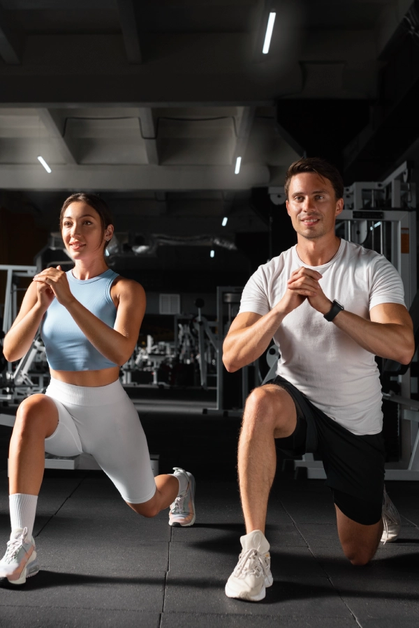 woman-helping-man-gym